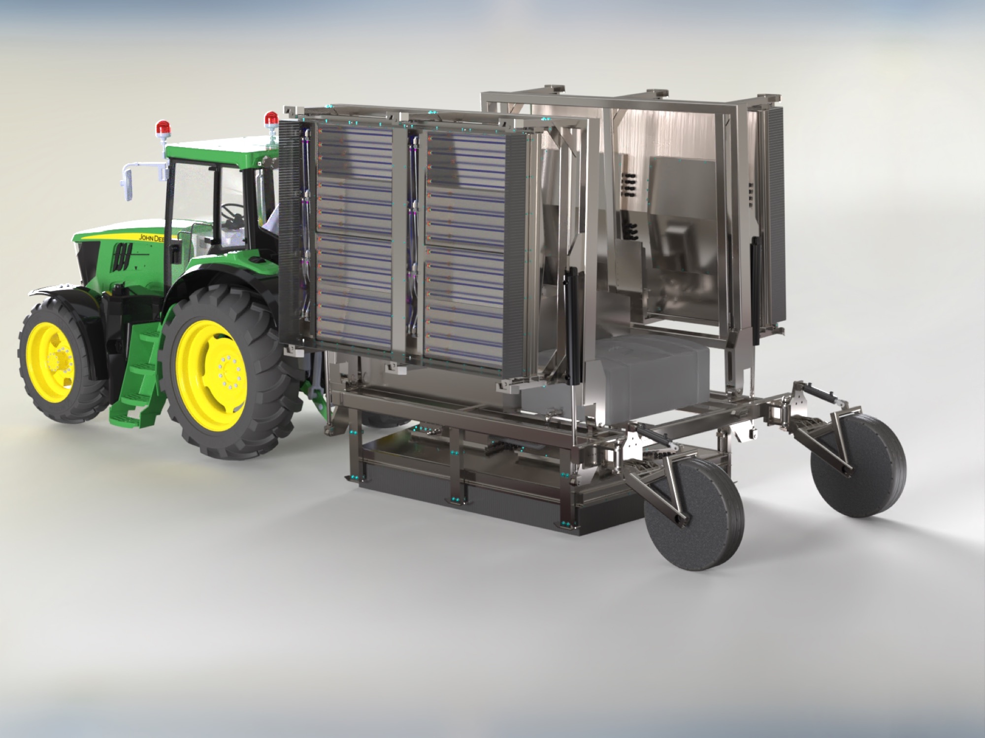 Tractor-towed stainless harvesting machine built by Pure Life Machinery
