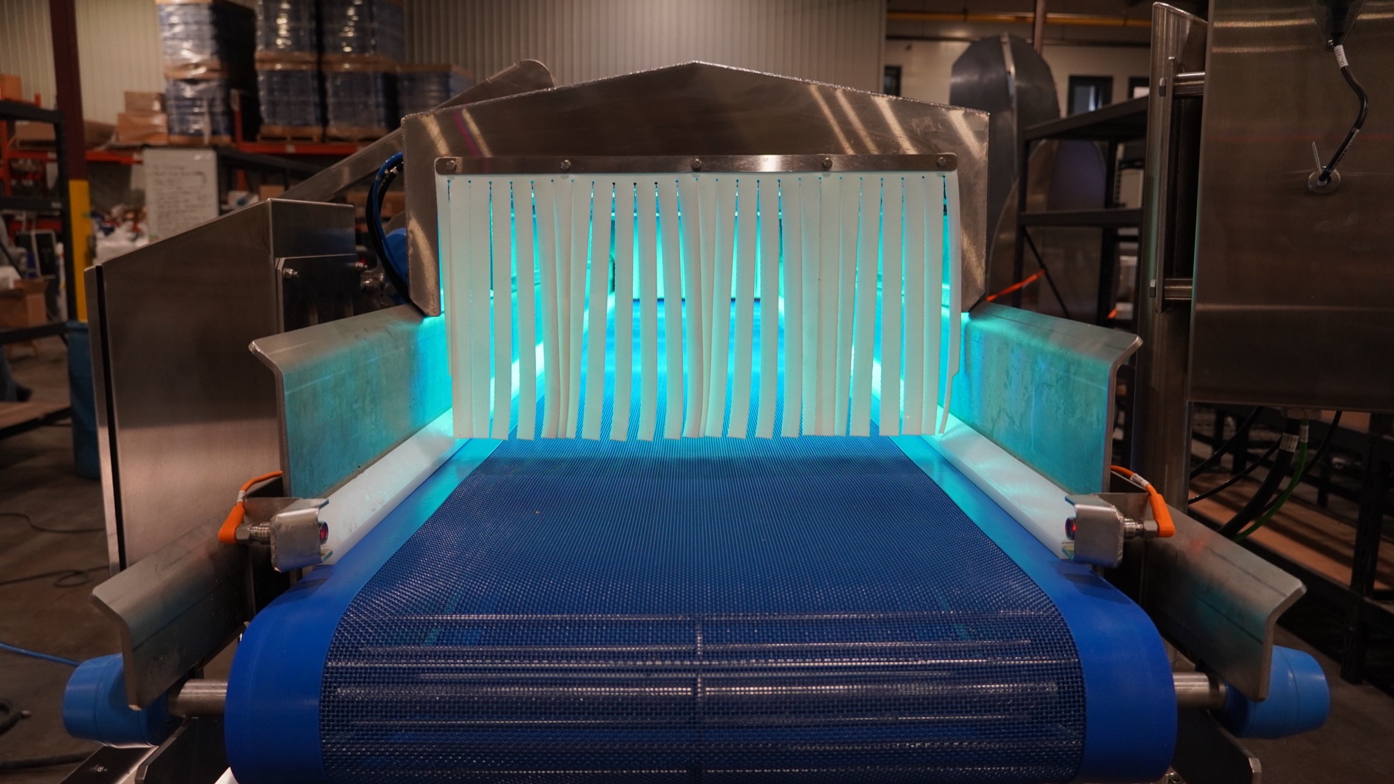 UV cleaning conveyor lit blue during testing